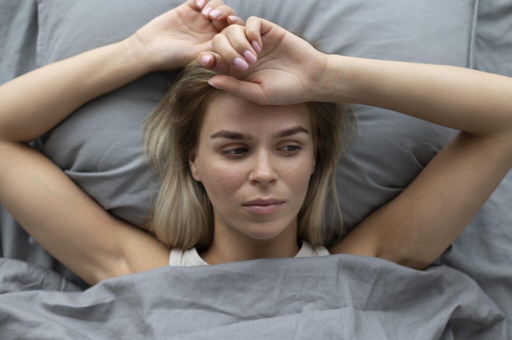 Woman awake at night with menopause symptoms